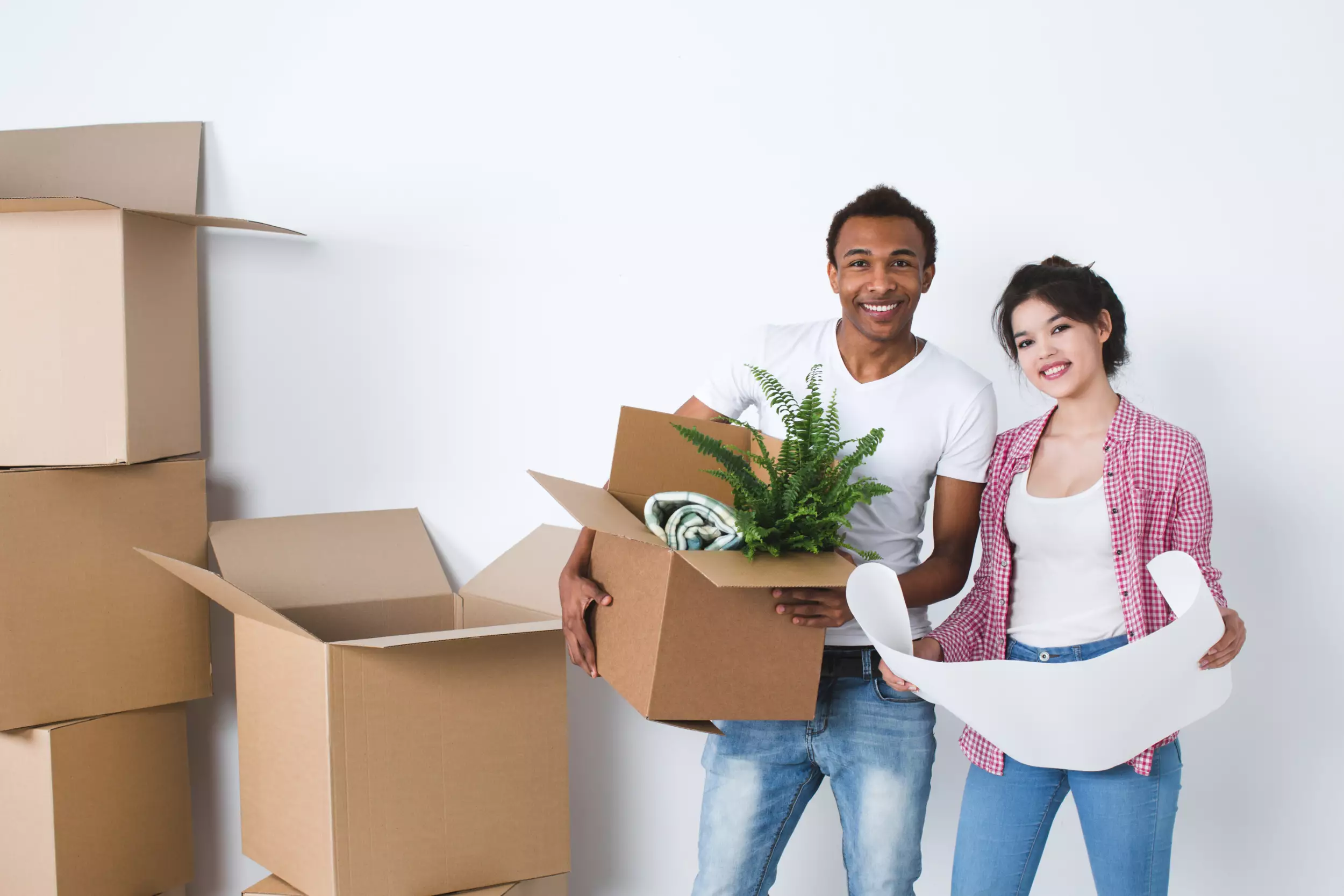 A young couple moving into a new home